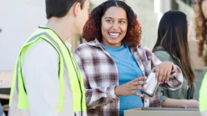 Two people helping out at a food pantry.