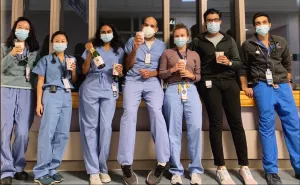 Residents posing with cups