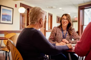 Social worker, Danica Grillo, meeting with family at High Point House about family resources.